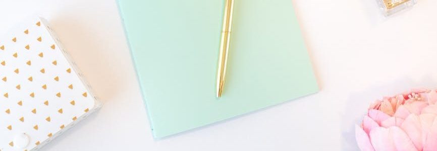 teal notebook and white and pink roses on white background Photo by Katie Harp on <a href="https://www.pexels.com/photo/teal-notebook-and-white-and-pink-roses-on-white-background-4508071/" rel="nofollow">Pexels.com</a>